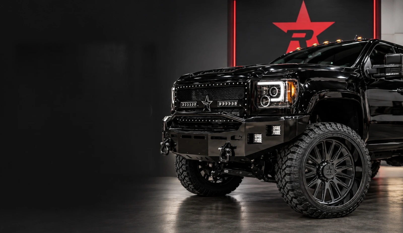 Black lifted RBP truck in the RBP showroom